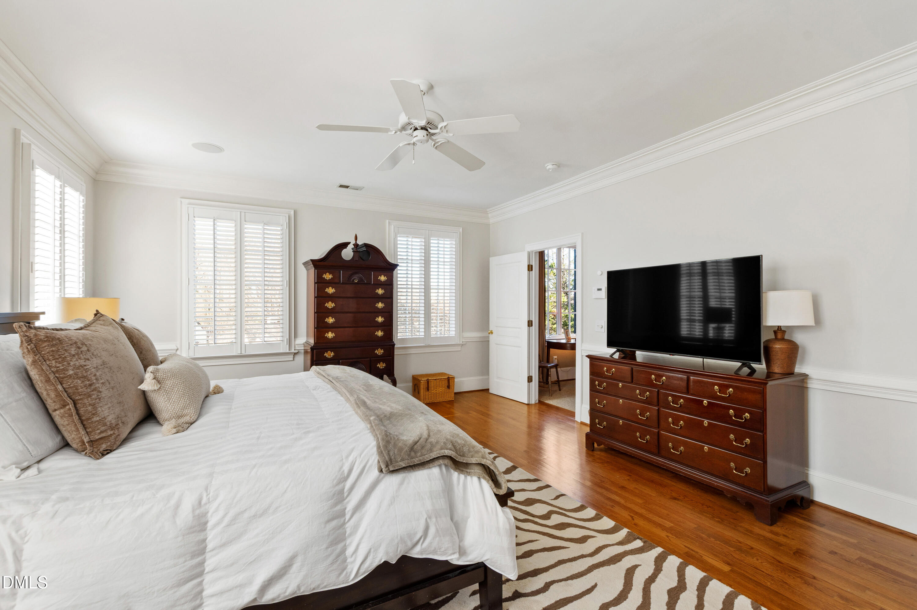 2536 Wake Drive Raleigh, NC 27608 - Photo 33 of 74 a bedroom with a bed and a flat screen tv