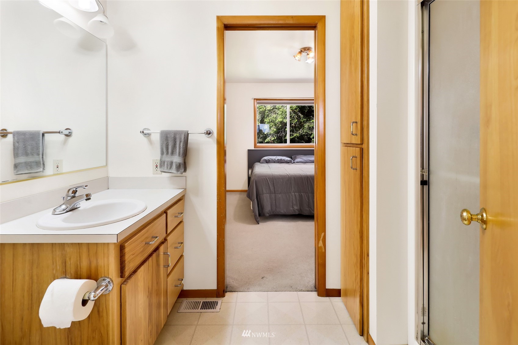 3938 Bowen Road Sumas, WA 98295 - Photo 23 of 34 a bathroom with a sink and a mirror