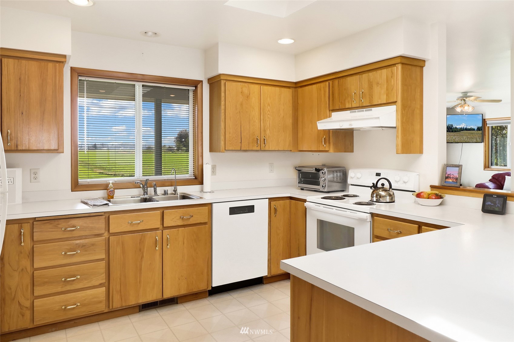 3938 Bowen Road Sumas, WA 98295 - Photo 6 of 34 a kitchen with a sink stove and cabinets