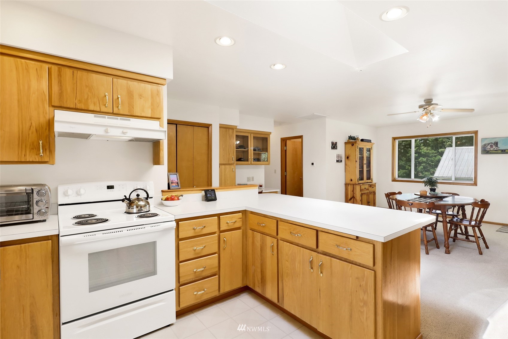 3938 Bowen Road Sumas, WA 98295 - Photo 7 of 34 a kitchen with a stove a sink and a refrigerator