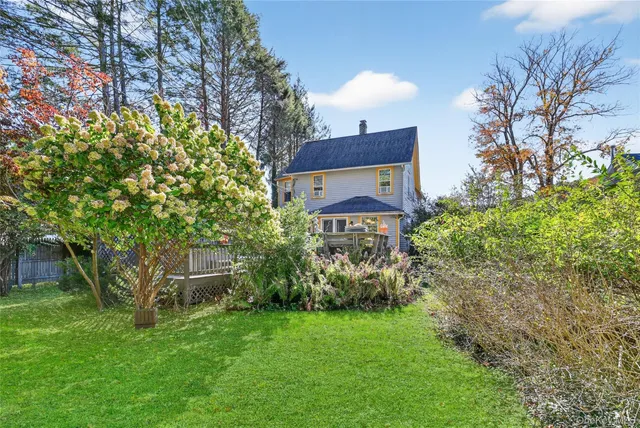 an aerial view of house with swimming pool