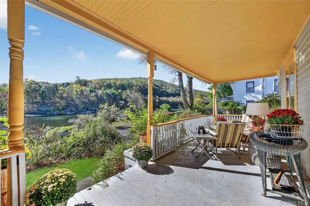 a view of a patio with a table and chairs
