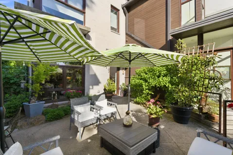 a view of a chairs and table in the patio