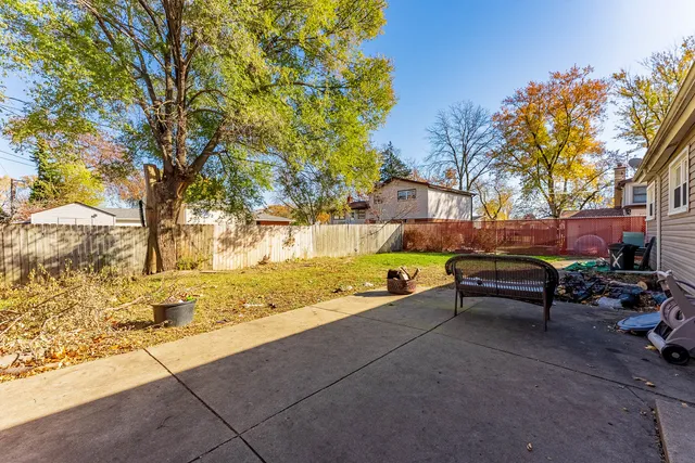 a bench sitting in the middle of a yard