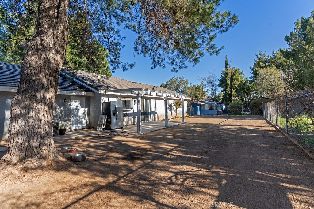 7365 Chase Hesperia, CA 92345 - Photo 16 of 21 a front view of a house with a yard