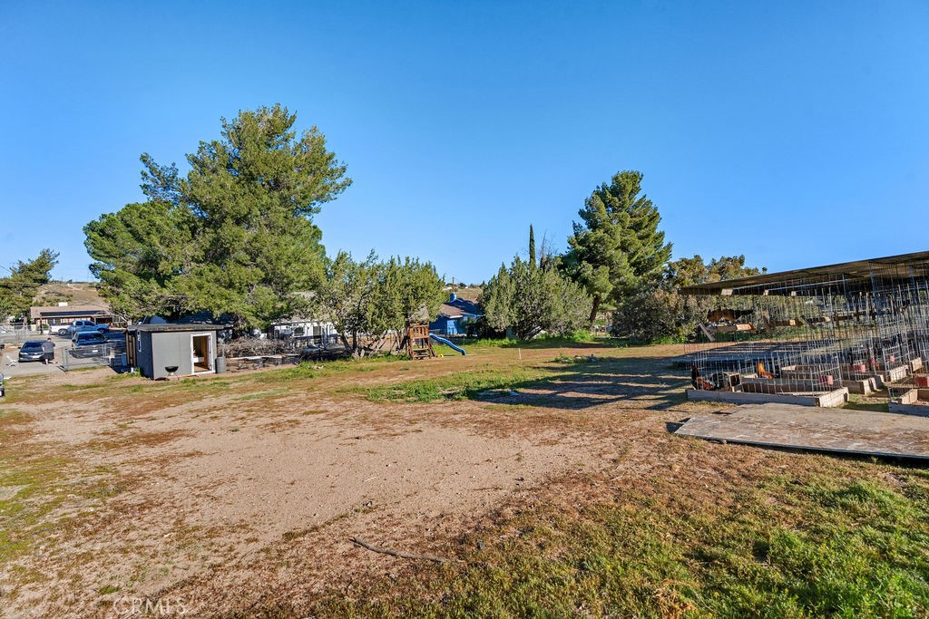7365 Chase Hesperia, CA 92345 - Photo 18 of 21 a street view with large trees