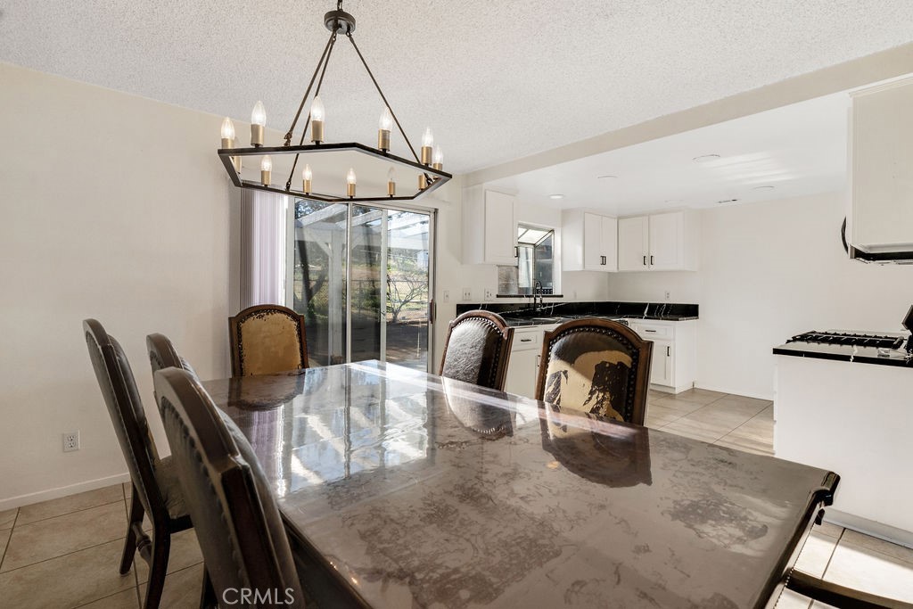 7365 Chase Hesperia, CA 92345 - Photo 8 of 21 a dining room with furniture and window