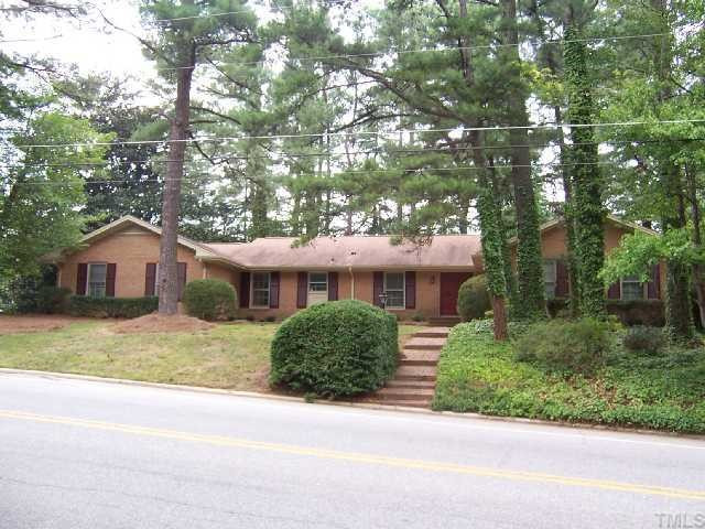 2501 10th Avenue Raleigh, NC 27612 - Photo 1 of 12 a front view of a house with a garden