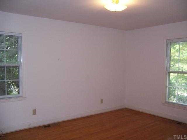 2501 10th Avenue Raleigh, NC 27612 - Photo 8 of 12 an empty room with a window