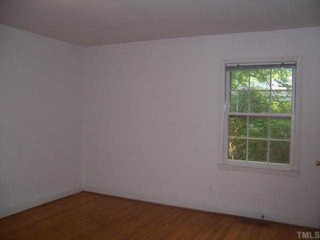 2501 10th Avenue Raleigh, NC 27612 - Photo 9 of 12 an empty room with a window