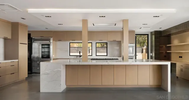 a kitchen with stainless steel appliances granite countertop a sink and cabinets