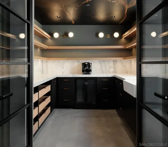 a kitchen with a sink and cabinets