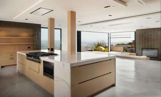 a kitchen with stainless steel appliances a stove and more cabinets