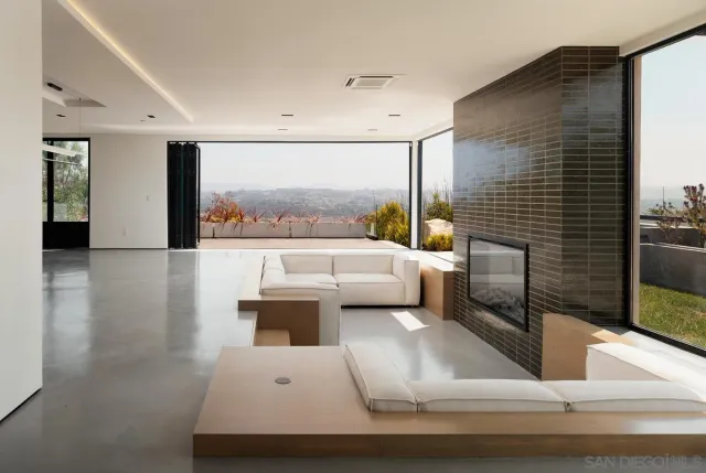 a lobby with furniture and a large window