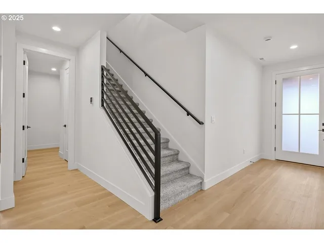 a view of entryway with wooden floor