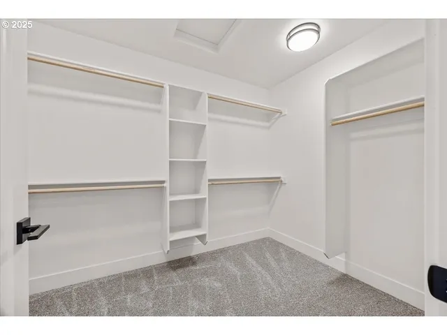 a view of an empty walk in closet