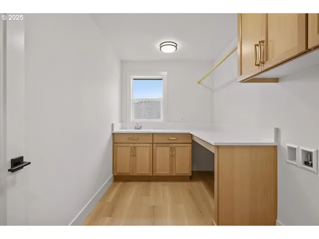 a kitchen with a refrigerator and a sink