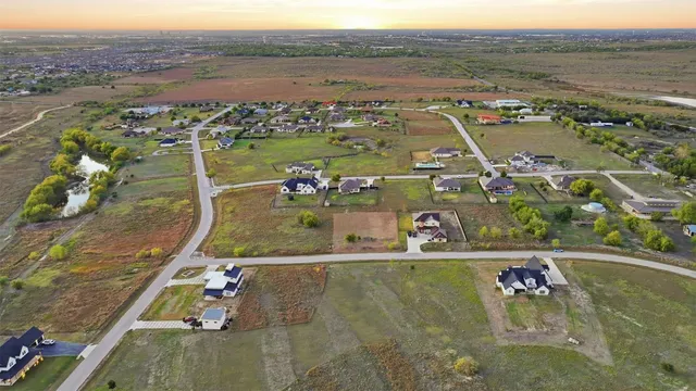 an aerial view of a house with a ocean view