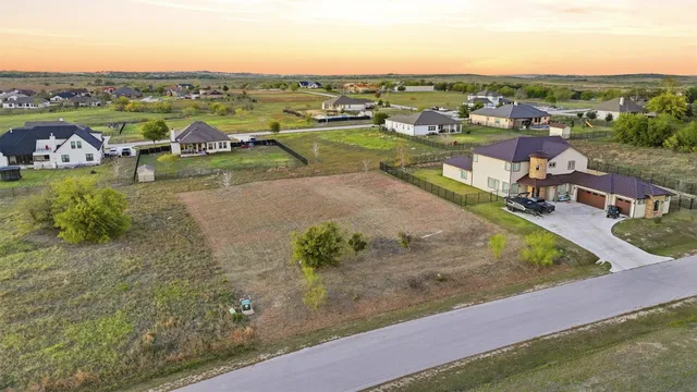 an aerial view of a houses with outdoor space