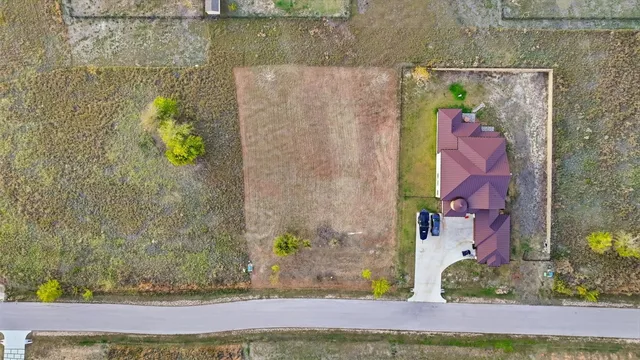 swimming pool view with a garden space