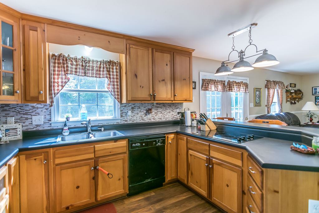 1283 Union Church Road Churchville, VA 24421 - Photo 16 of 50 a kitchen with stainless steel appliances granite countertop a sink a stove cabinets counter space and a window