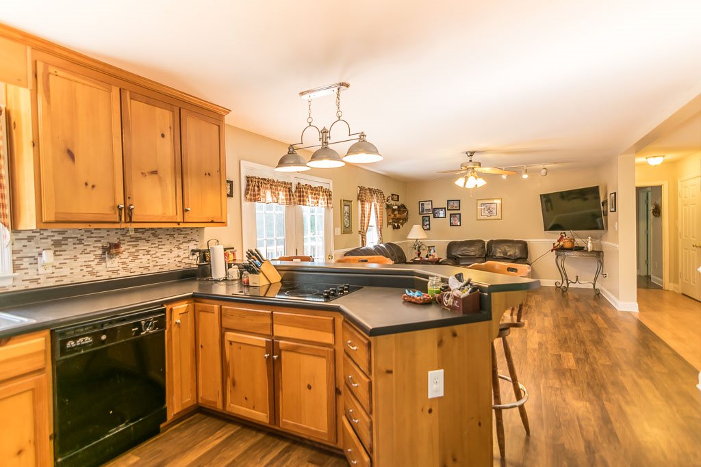 1283 Union Church Road Churchville, VA 24421 - Photo 19 of 50 a kitchen with stainless steel appliances granite countertop a sink stove and cabinets
