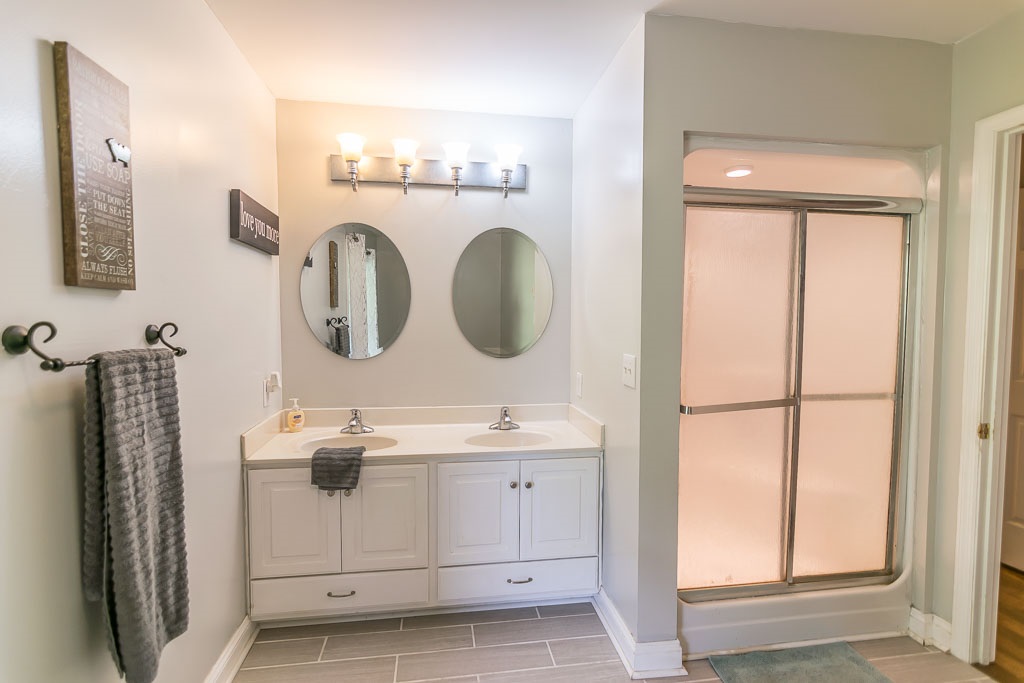 1283 Union Church Road Churchville, VA 24421 - Photo 33 of 50 a bathroom with a sink and a mirror