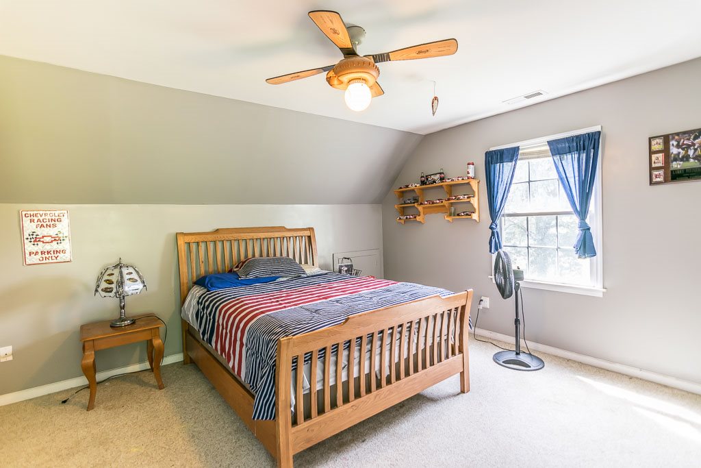 1283 Union Church Road Churchville, VA 24421 - Photo 45 of 50 a bedroom with a bed and a chandelier