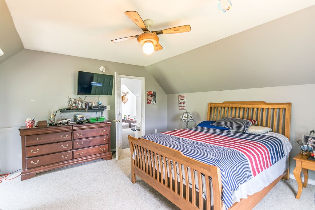 1283 Union Church Road Churchville, VA 24421 - Photo 46 of 50 a bedroom with a bed and a chandelier