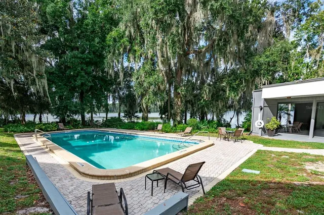 a view of a swimming pool with a patio