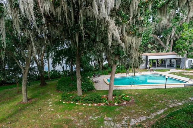 a view of house with a yard