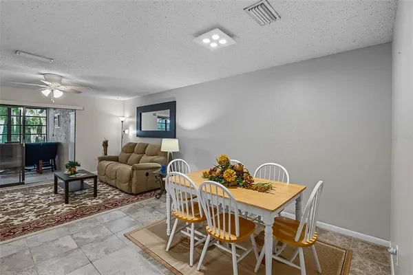 a view of a livingroom with furniture and a table