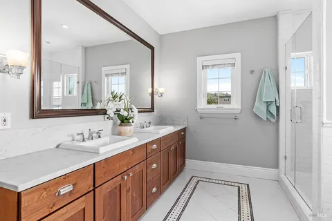 a bathroom with a sink a vanity and a mirror