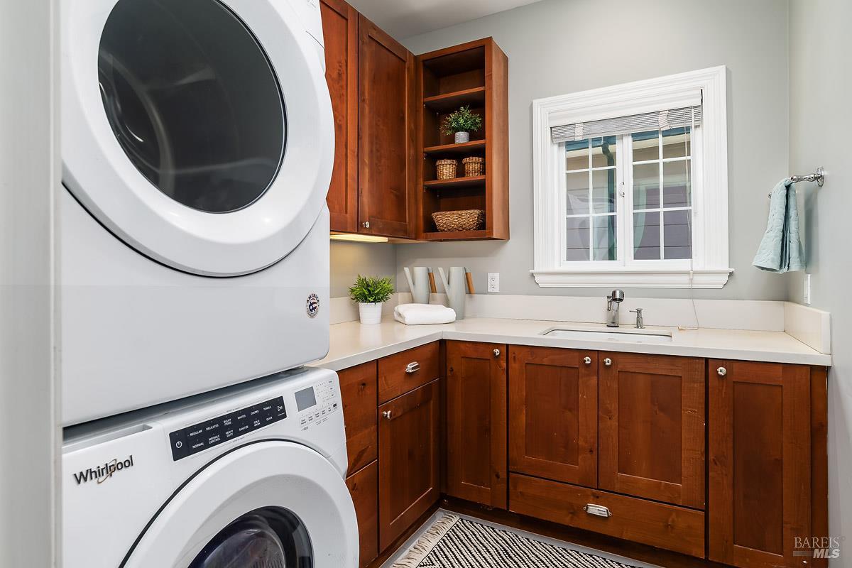 56 Mooring Road San Rafael, CA 94901 - Photo 27 of 45 Fully outfitted laundry room with sink next to bedrooms