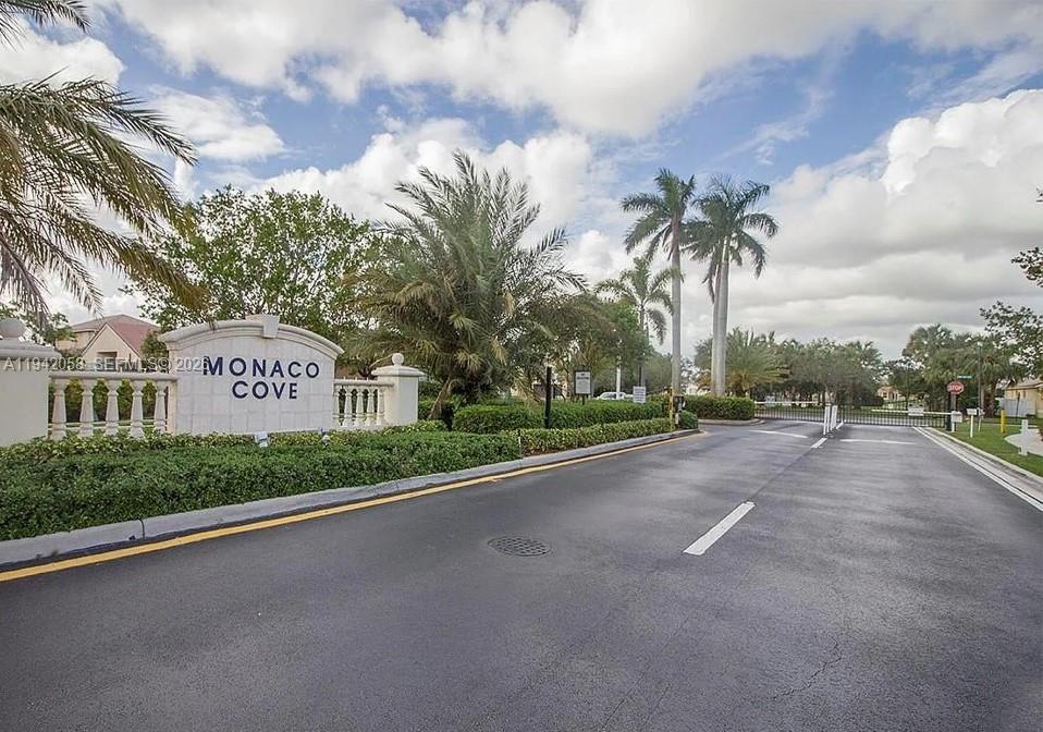 a view of a street with a building in the background