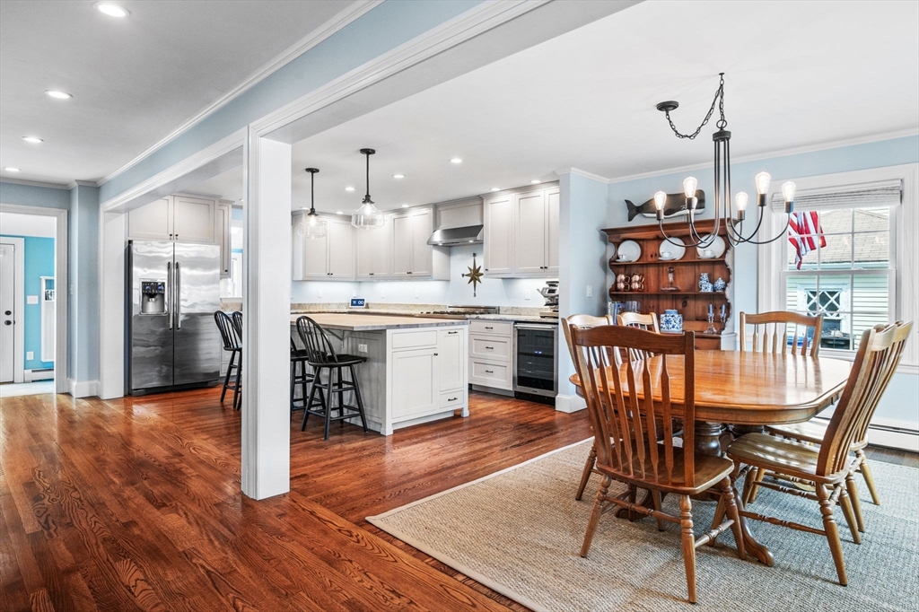 9 Sevinor Road Marblehead, MA 01945 - Photo 10 of 39 a dining room with stainless steel appliances kitchen island granite countertop a dining table chairs and a oven
