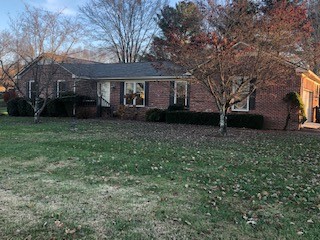 229 Oakland Drive Sparta, TN 38583 - Photo 1 of 26 a front view of a house with garden