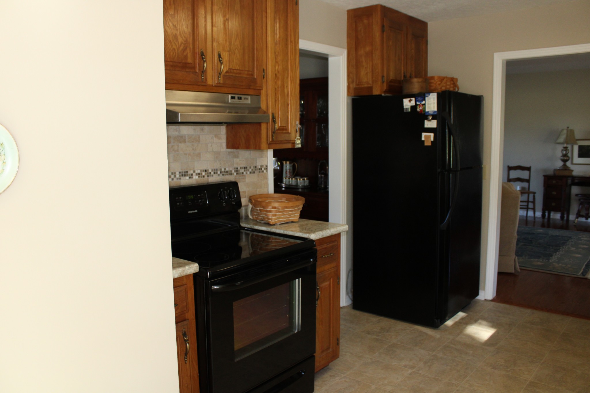 229 Oakland Drive Sparta, TN 38583 - Photo 14 of 26 a kitchen with a refrigerator and cabinets