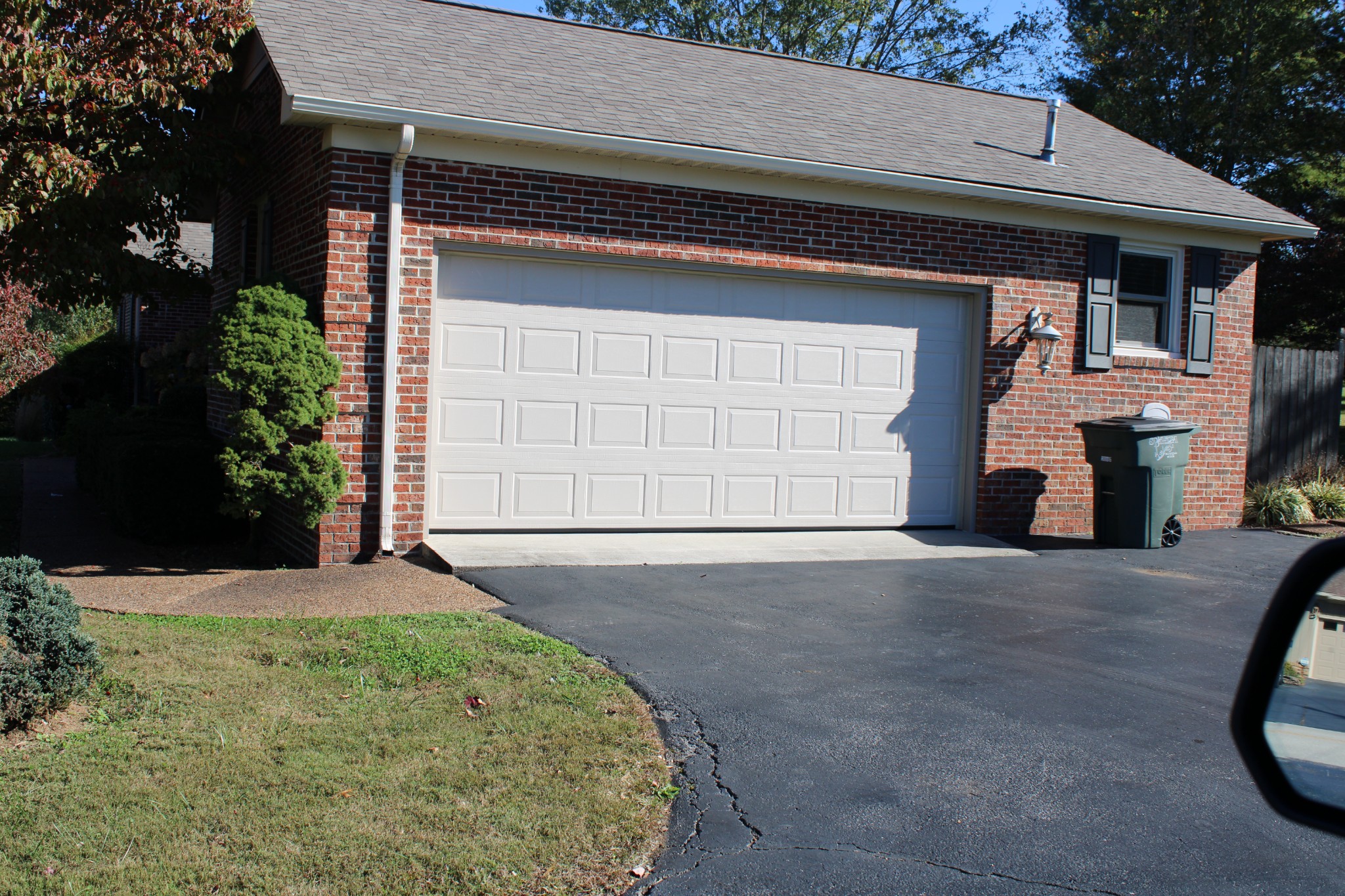 229 Oakland Drive Sparta, TN 38583 - Photo 26 of 26 a front view of a house with a yard and garage