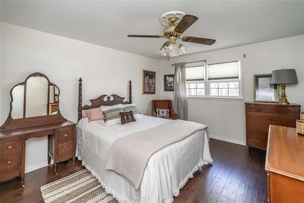 a bed room with a bed and a chandelier