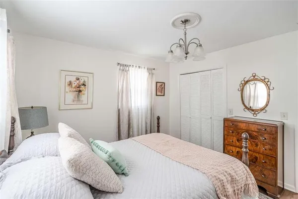 a utility room with furniture a flat screen tv and a fireplace