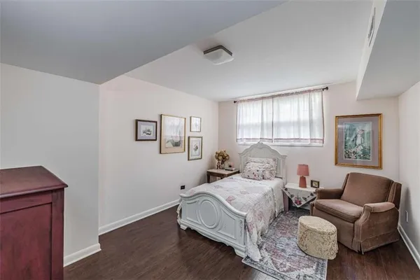 a bedroom with furniture and a window