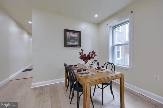 a dining room with furniture and window