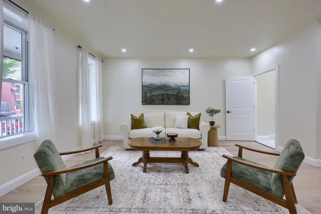 a living room with furniture and a rug