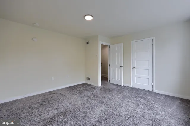 a view of a wooden house with a yard