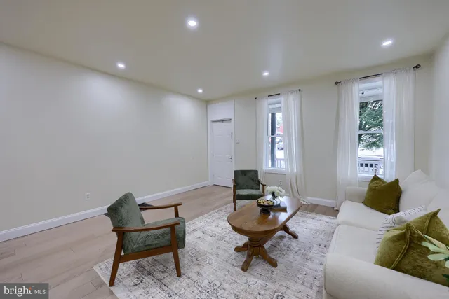 a living room with furniture and a rug