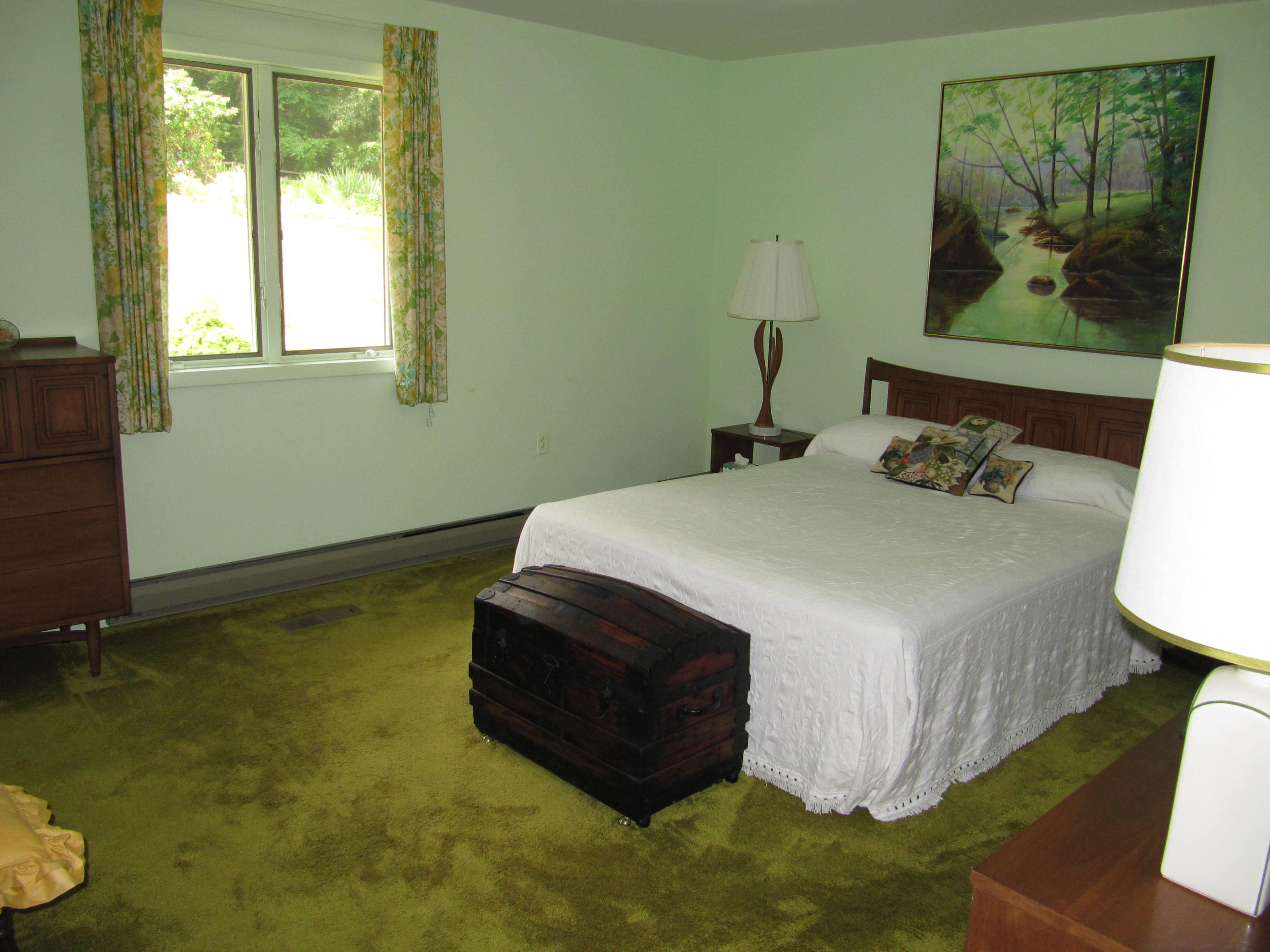 960 Tuggles Gap Road Southwest Floyd, VA 24091 - Photo 54 of 95 a bedroom with a bed and a painting on the wall