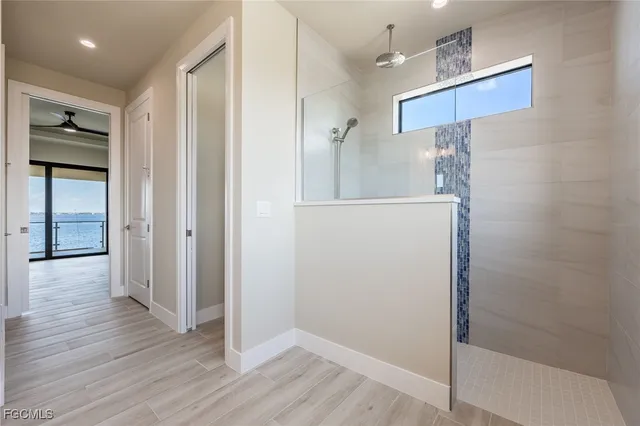 a view of a dining room with furniture wooden floor and chandelier