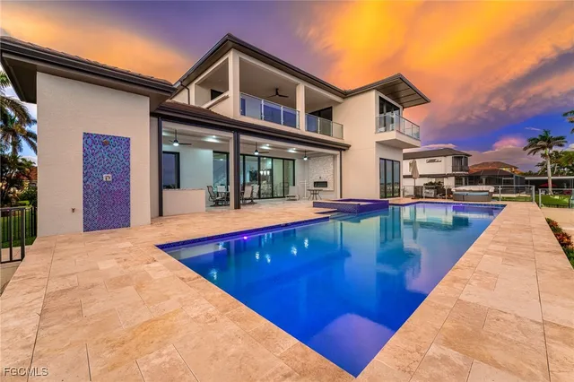 a bedroom with a bed and glass walk in closet