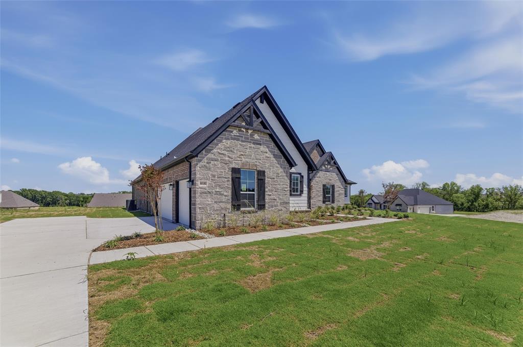 815 Vly Rdg Road Van Alstyne, TX 75495 - Photo 2 of 29 Stone and siding exterior with dark gables